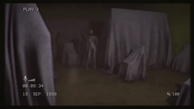 The Backrooms 1998 screenshot: a pale thin figure stands among furniture covered in white sheets, seen through camcorder footage dated 19 Sep 1998
