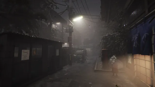 A foggy narrow village street at night lit by a streetlight, with the bathhouse curtain on the right