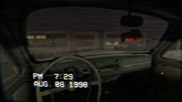 The Building 71 Incident screenshot: the inside of a parked car at night, seen through the camcorder at 7:29 PM