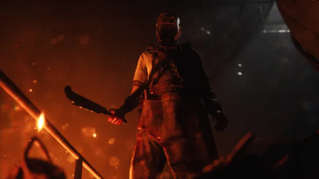 Frank Stone in a welding mask and chains holding a long blade in the orange glow of the steel mill