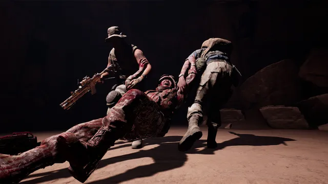 House of Ashes screenshot: a wounded soldier is dragged across a dark cave floor by two others