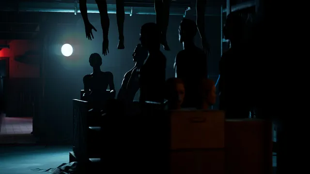 The Devil in Me screenshot: mannequins and figures in silhouette in a dim room lit by a single lamp
