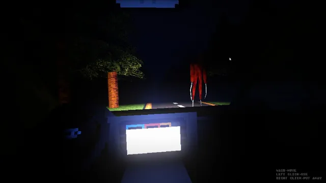 Looking out of the car at night: a tree by the road and a tall red figure standing at the roadside