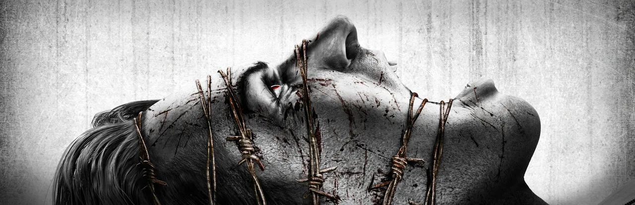 The Evil Within key art: a man's bloodied face wrapped in barbed wire