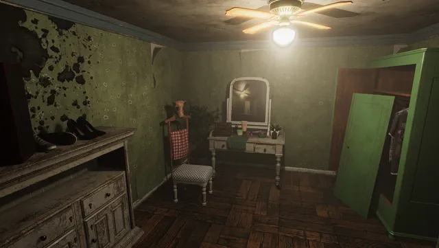 A decayed hotel bedroom with peeling green walls, a dressing table and an open wardrobe