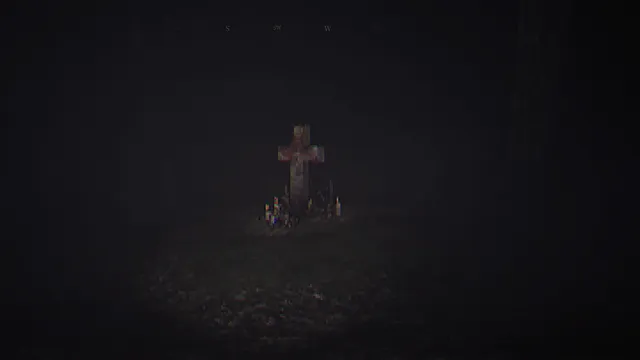 The House In The Woods screenshot: a wooden cross with candles at its foot in a clearing at night