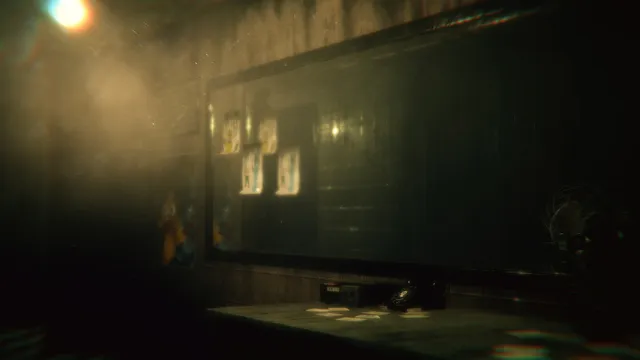The Joy of Creation: Halloween Edition screenshot: a misty security office with a phone on the desk, a dark window and posters on the wall