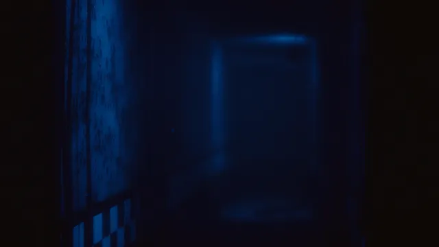 The Joy of Creation: Halloween Edition screenshot: a dark hallway lit blue, leading to a doorway