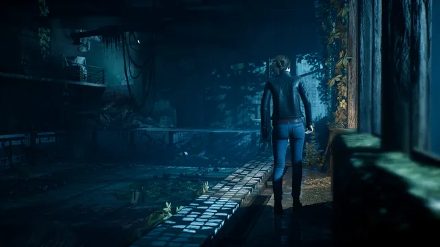 The Medium screenshot: Marianne in a leather jacket walks along a dark, ruined indoor pool by tall windows overgrown with vines
