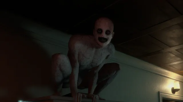 The Mortuary Assistant screenshot: a pale, hairless figure with black eyes crouches on a table in a dark corridor