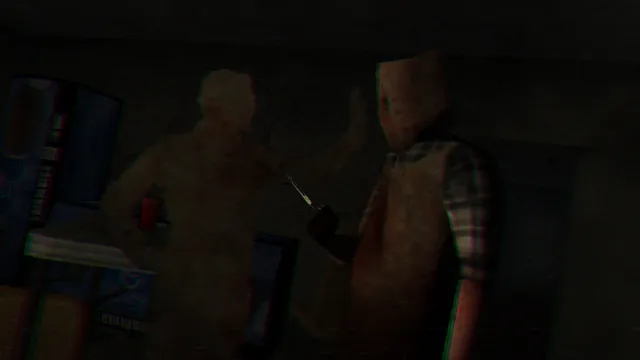The killer with a cardboard box over his head raises scissors at Adam in a dark room