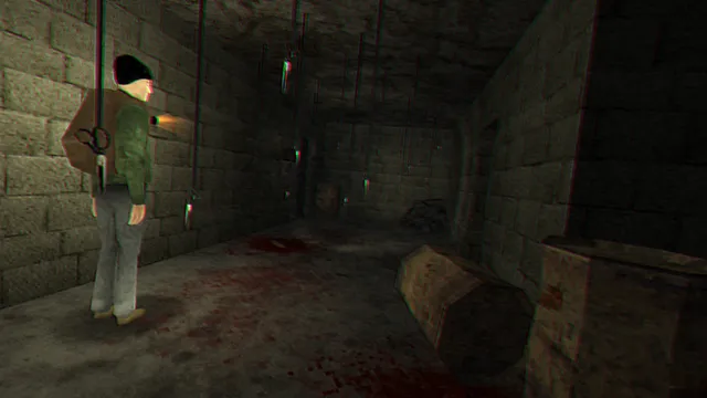 Adam in a beanie and green jacket stands in a stone corridor with blood on the floor and scissors hanging from the ceiling