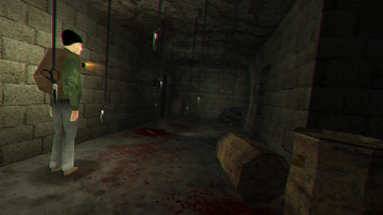 Adam in a beanie and green jacket stands in a stone corridor with blood on the floor and scissors hanging from the ceiling