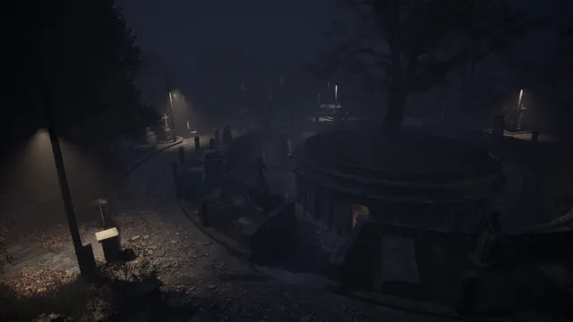 A cemetery at night seen from above, with a large tree, gravestones and dim lamps in the fog