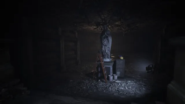 A statue of a robed figure in a dim crypt with a ladder and buckets beside it