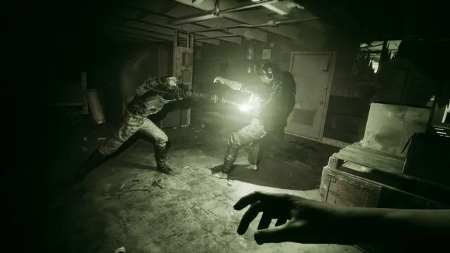 The Outlast Trials screenshot: a test subject in first person shines a light while a teammate grapples with an enemy in a dark storeroom