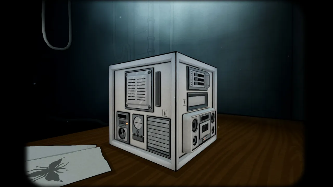 The Past Within: a white metal puzzle box with grilles, dials and switches on a wooden floor, a drawing of a fly on papers beside it