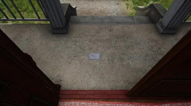 An envelope lying on the mansion's doorstep, seen through the open front door