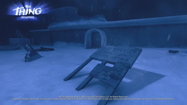 The Thing: Remastered screenshot: a snow-buried Antarctic research station with a toppled United States National Science Institute Station 4 sign