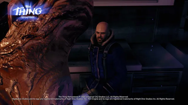 The Thing: Remastered screenshot: a bald soldier in a blue parka shines a light on a glistening red alien mass in a dark kitchen