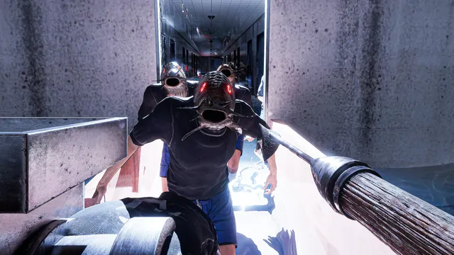 People with fish heads crowd a narrow concrete corridor toward the player, one with glowing red eyes