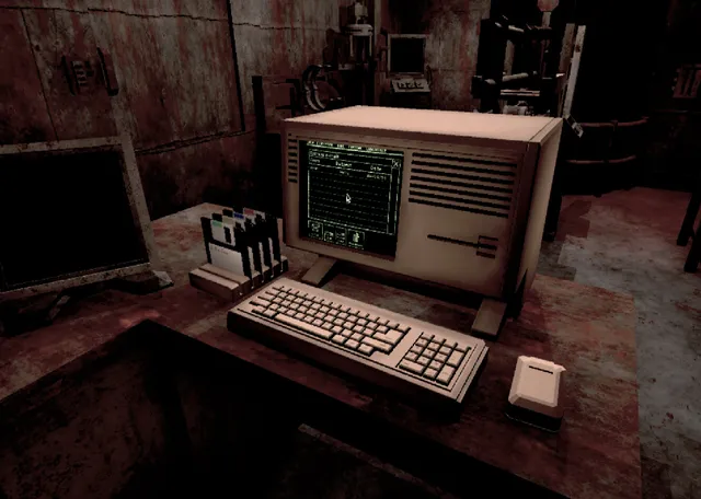 An old beige computer and keyboard on a desk in a grimy, red-stained facility room