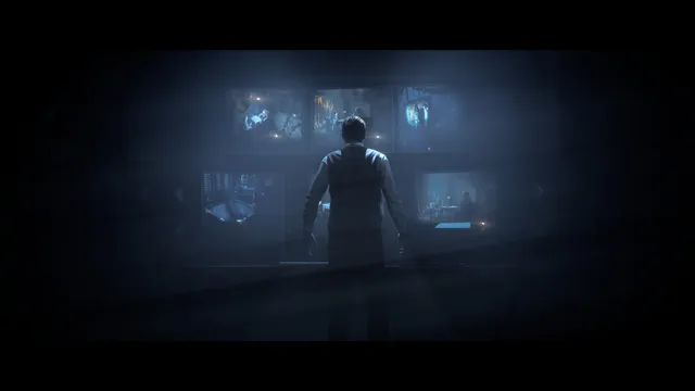 Until Dawn screenshot: a man stands before a wall of security monitors in a dark room