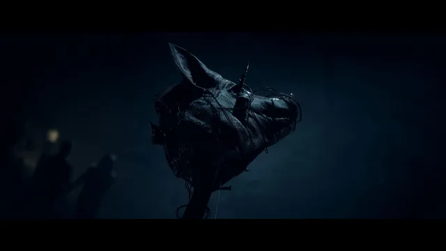Until Dawn screenshot: a pig's head on a stake lit in the dark woods