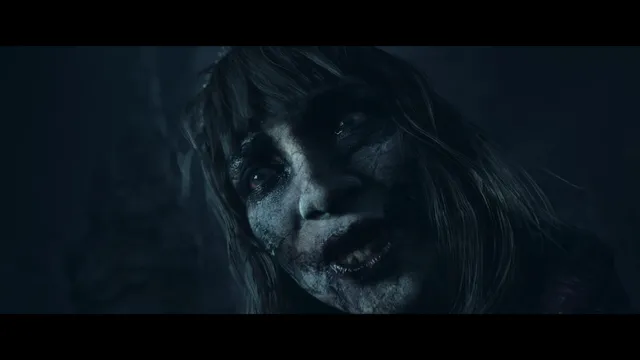 Until Dawn screenshot: a pale, grinning face with sunken eyes in the dark