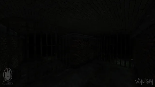 A dark brick tunnel closed off by iron bars on both sides