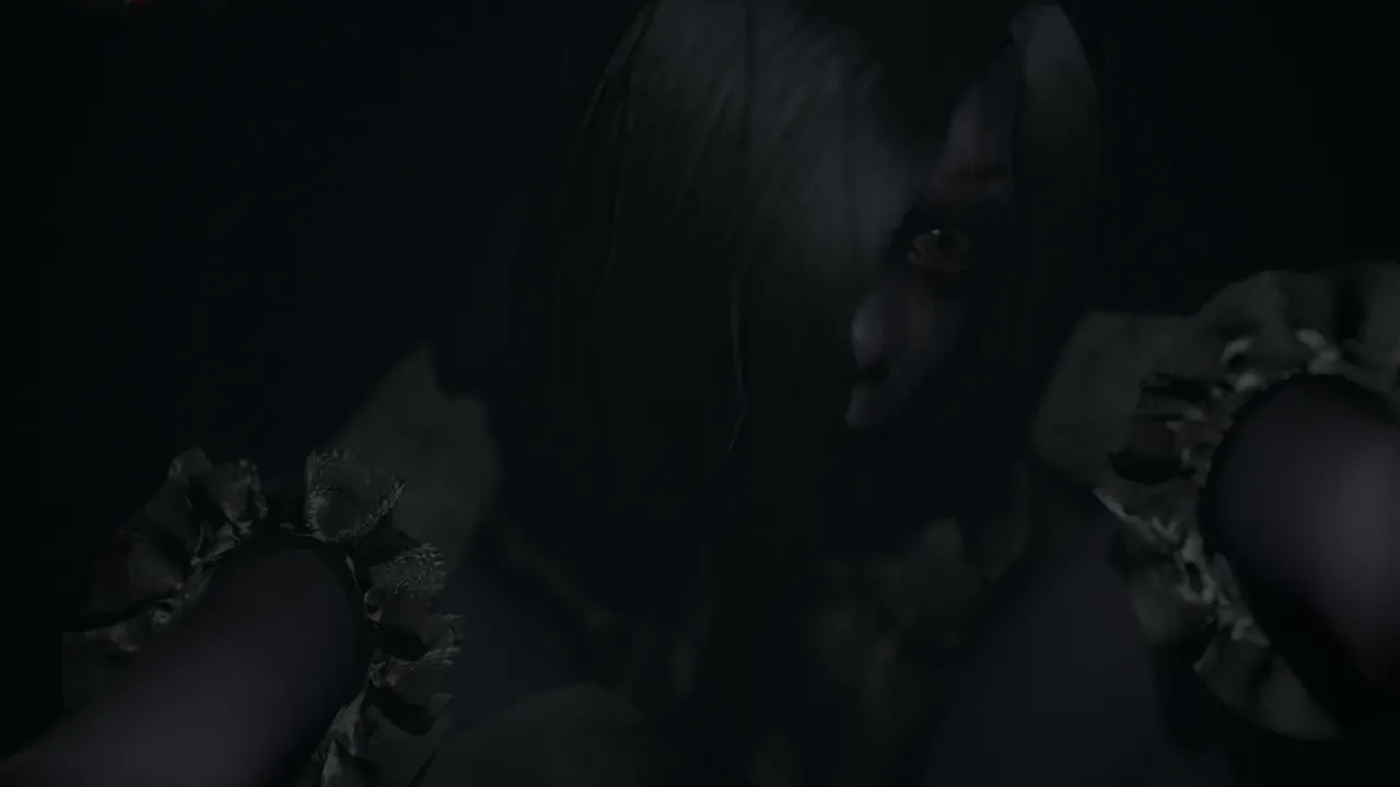 Visage screenshot: a long-haired ghostly woman leans close into the camera in the dark