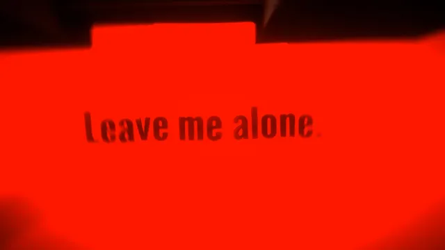 When the Darkness comes screenshot: the words Leave me alone on a glaring red screen