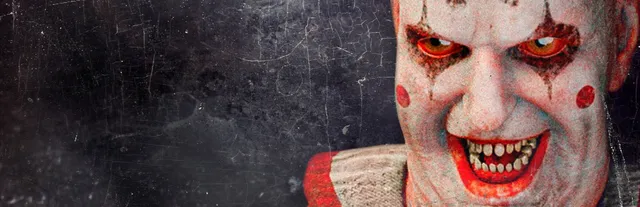 You Are Grounded art: a clown with white face paint, red eyes and sharp teeth grins in a ruffled collar